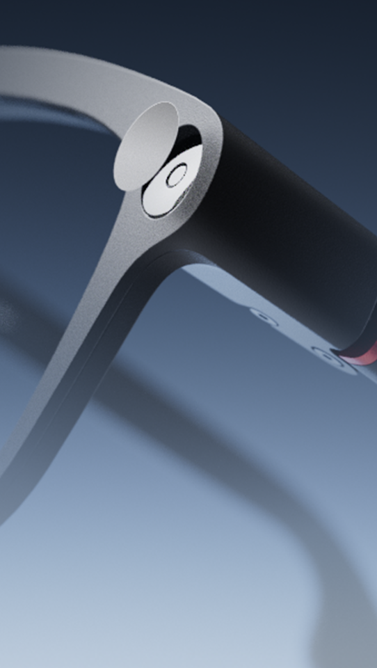 Close-up of the corner of INMO GO3 frames with a round camera cover lifted halfway off the camera lens